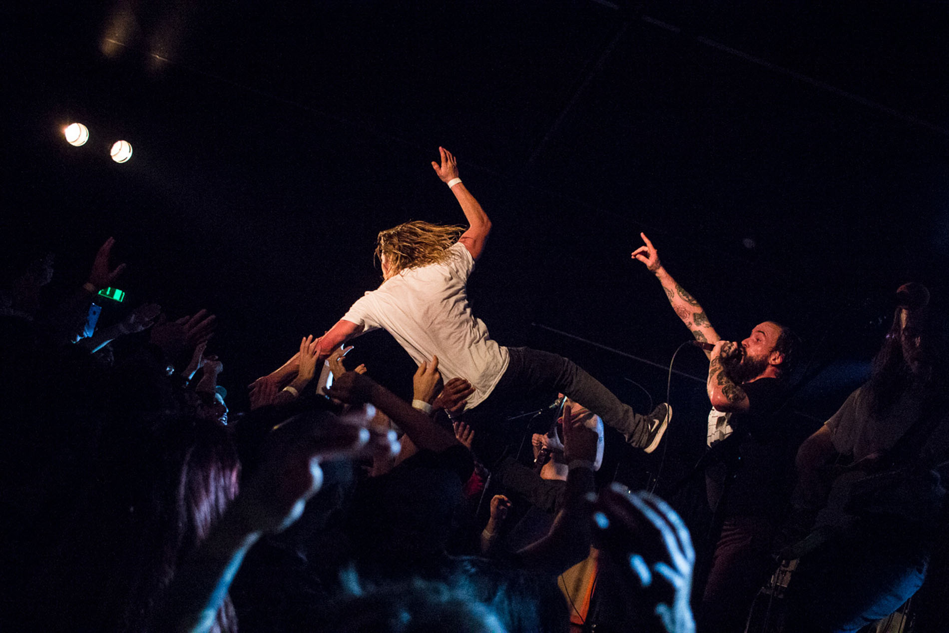Crowd-surfer carried above the audience during the IDLES performance at Hard Club.