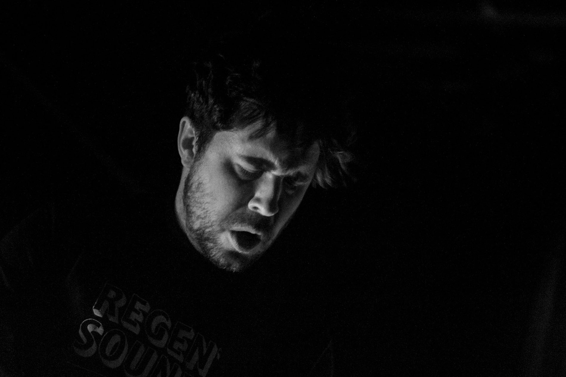 Musician from JOHN during a quiet moment of the Hard Club performance.